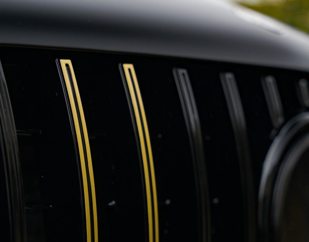 gle satin black carwrap with gold details